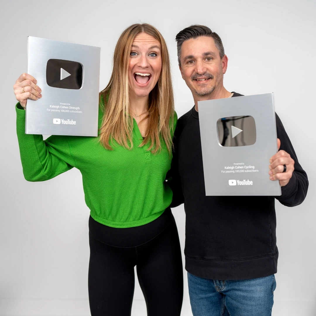 Kaleigh and Jason Cohen holding two YouTube Silver Creator Awards